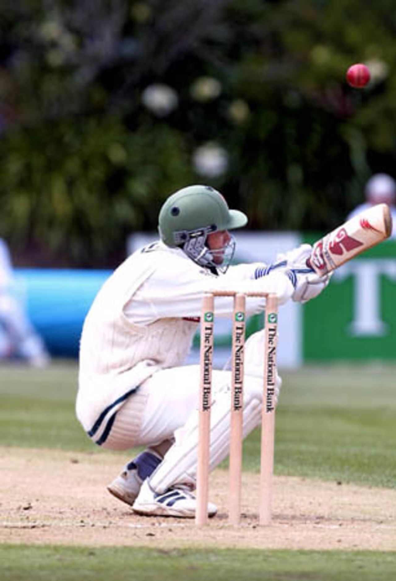 Bangladeshi batsman Khaled Mashud ducks underneath a bouncer delivered by Auckland bowler Andre Adams during his innings of 30 not out. Tour match: Auckland v Bangladeshis at Eden Park Outer Oval, Auckland, 12-15 Dec 2001 (12 December 2001).