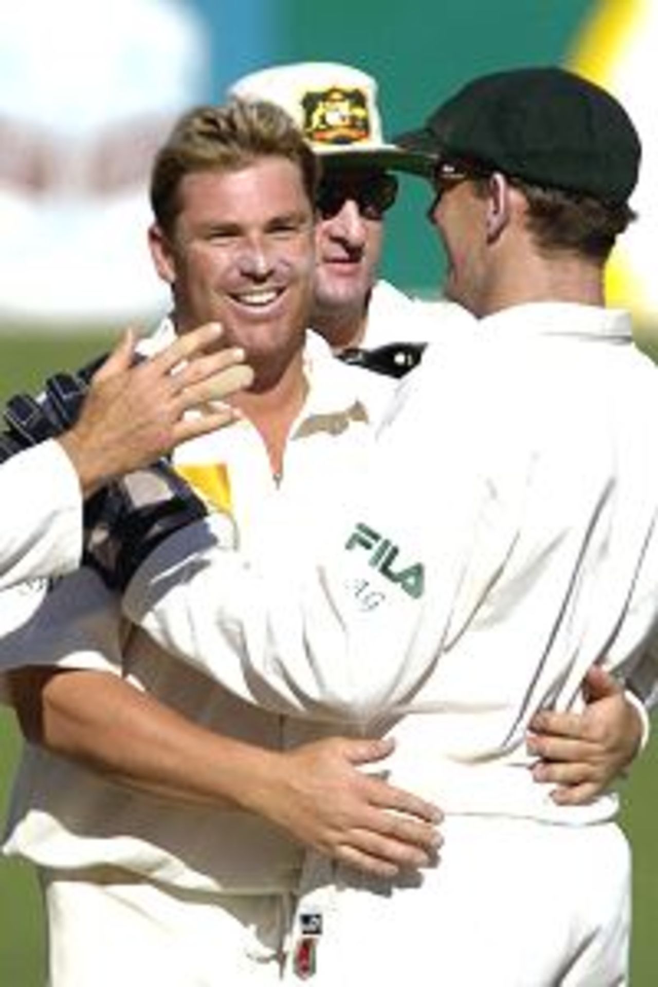 16 Dec 2001: Shane Warne of Australia celebrates with 'keeper Adam Gilchrist after South African captain Shaun Pollock was caught behind off Warne for a duck on the third day the first test between Australia and South Africa played at Adelaide Oval in Adelaide, Australia.
