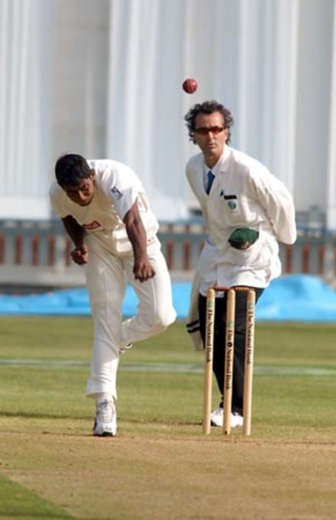 Bangladesh bowler Manjural Islam delivers a ball during his spell of 0-17 from seven overs on the first day. Umpire Brent Bowden looks on. 2nd Test: New Zealand v Bangladesh at Basin Reserve, Wellington, 26-30 Dec 2001 (26 December 2001).