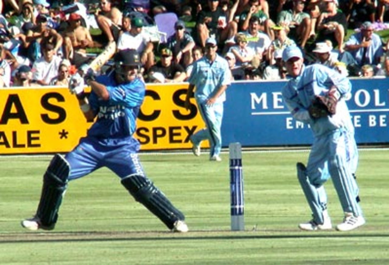 Andrew Puttick cuts powerfully to the point boundary