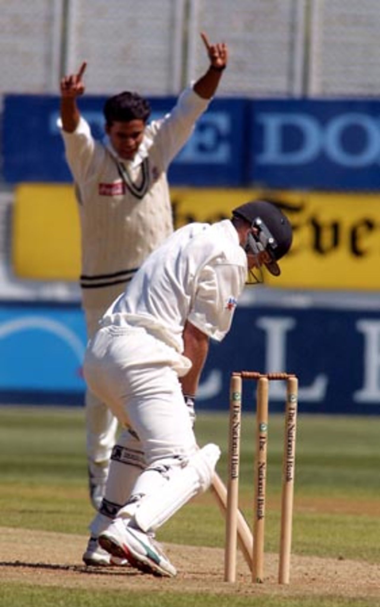 Bangladesh bowler Mashrafe Mortaza (rear) celebrates the dismissal of New Zealand batsman Lou Vincent, caught behind by wicket-keeper Khaled Mashud for 23 in his first innings. 2nd Test: New Zealand v Bangladesh at Basin Reserve, Wellington, 26-30 Dec 2001 (29 December 2001).
