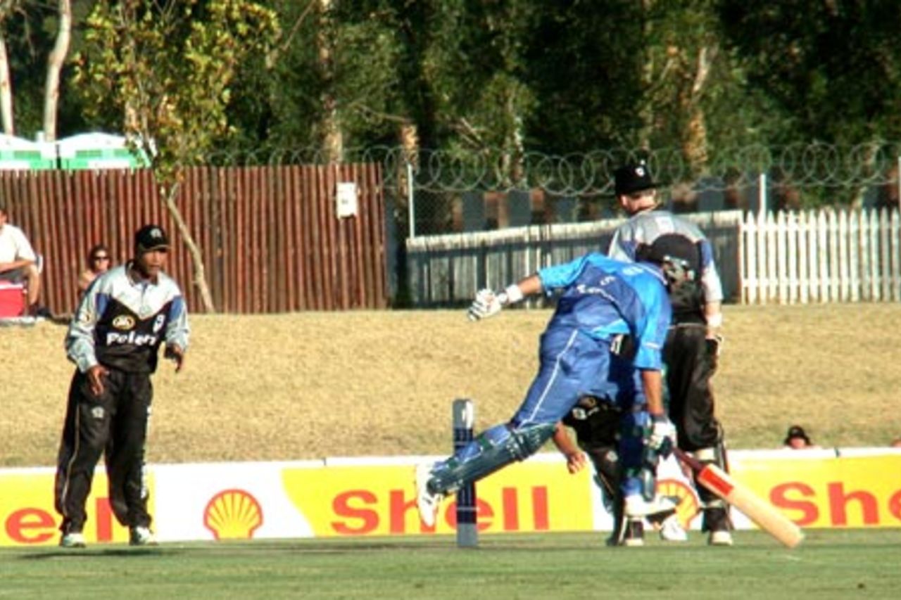 Boland fielder Quinton Davids watches as his teammates attempt to run out WP's Andrew Puttick in a Standard Bank Cup match at Paarl on Friday