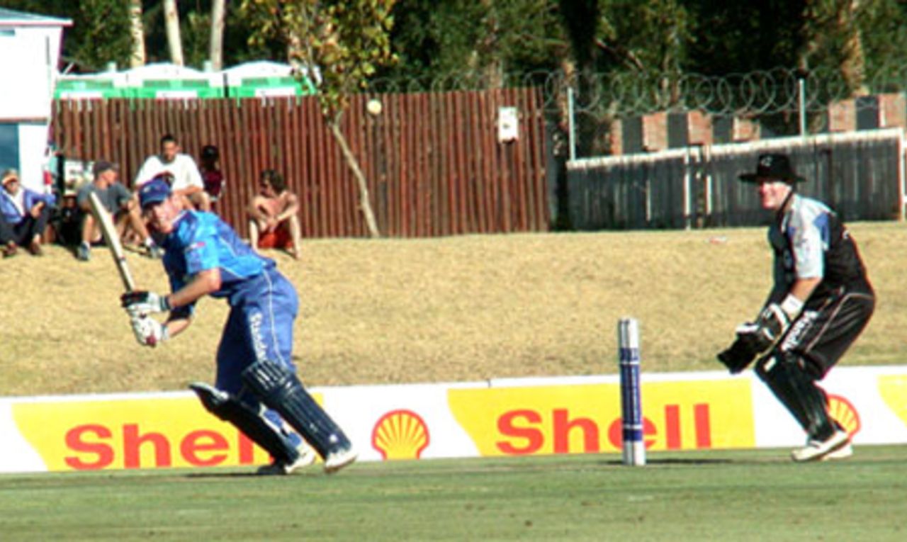 Neil Johnson cuts a ball to the point boundary  against Boland in a Standard Bank Cup match at Paarl on Friday
