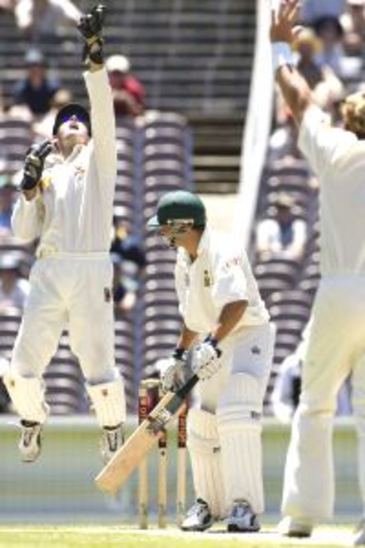 29 Dec 2001: Neil McKenzie of South Africa is out caught by Adam Gilchrist of Australia off the bowling of Shane Warne for 12, during day four of the second Test between Australia and South Africa, played at the Melbourne Cricket Ground, Melbourne, Australia.