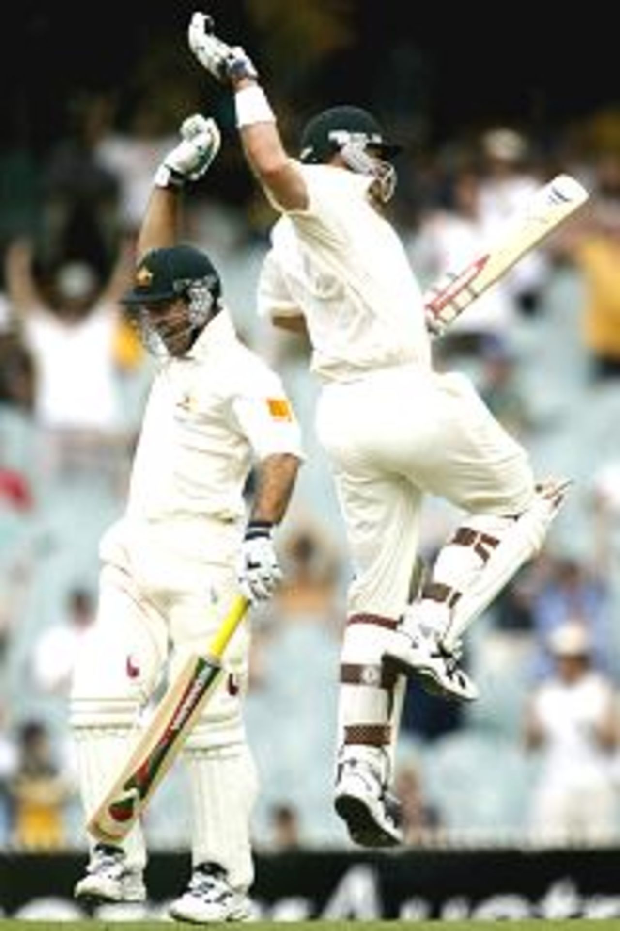29 Dec 2001: Matthew Hayden and Ricky Ponting from Australia celebrate while running the wining run to win the Test Series against South Africa at the Melbourne Cricket Ground in Melbourne, Australia.