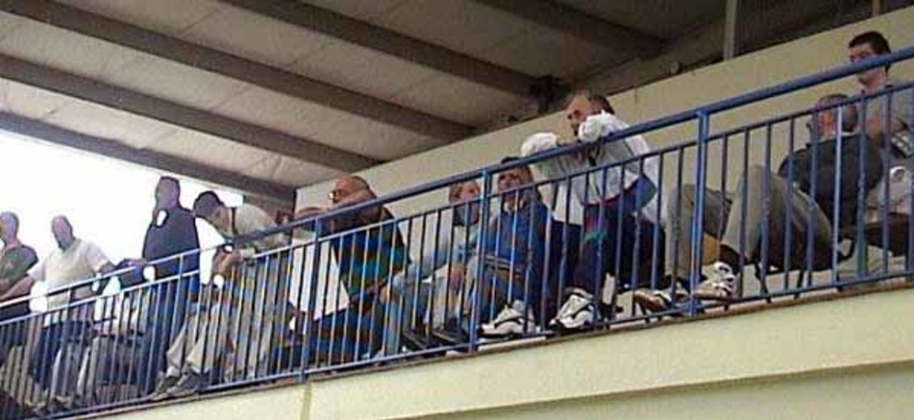 The spectators watch the indoor session from the gallery