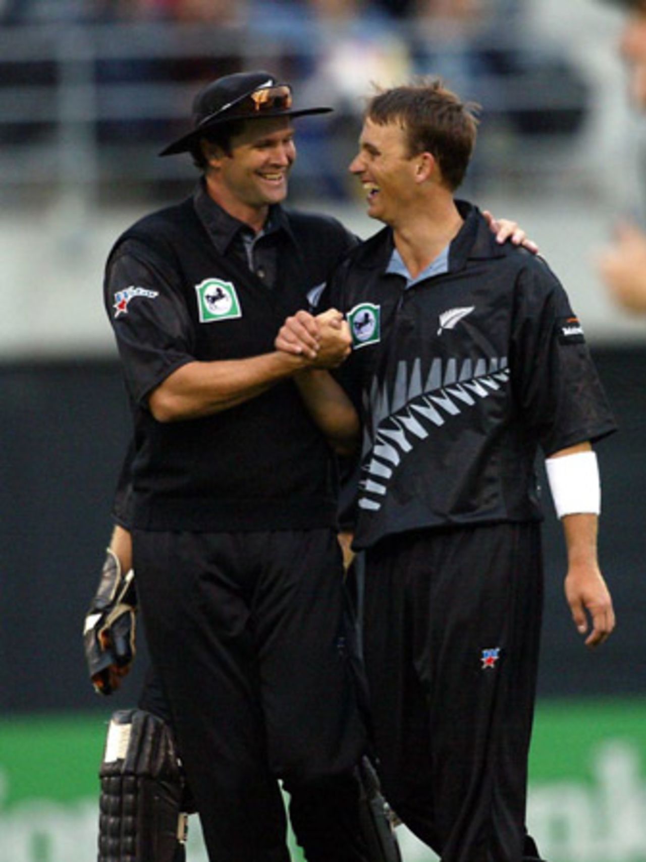New Zealand captain Chris Cairns (left) and bowler Shane Bond celebrate the dismissal of Indian batsman Virender Sehwag, caught by Andre Adams off the bowling of Bond for nine in his first innings. Super Max International: New Zealand v India at Jade Stadium, Christchurch, 4 December 2002.