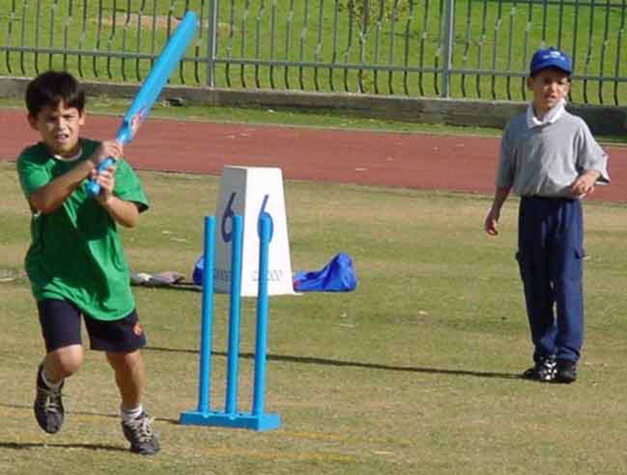 Al Charizi batsman Omri Savir plays a ball through midwicket as Ra'anana wicket - keeper Daniel Bergman looks on.