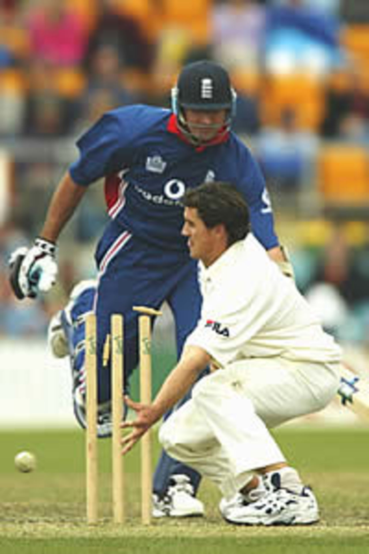 CANBERRA - DECEMBER 10: Lee Carseldine of the PM's XI attempts to run out Andy Caddick of England during the One Day Tour match between the Prime Minsters XI and England being played at the Manuku Oval, Canberra, Australia on December 10, 2002.