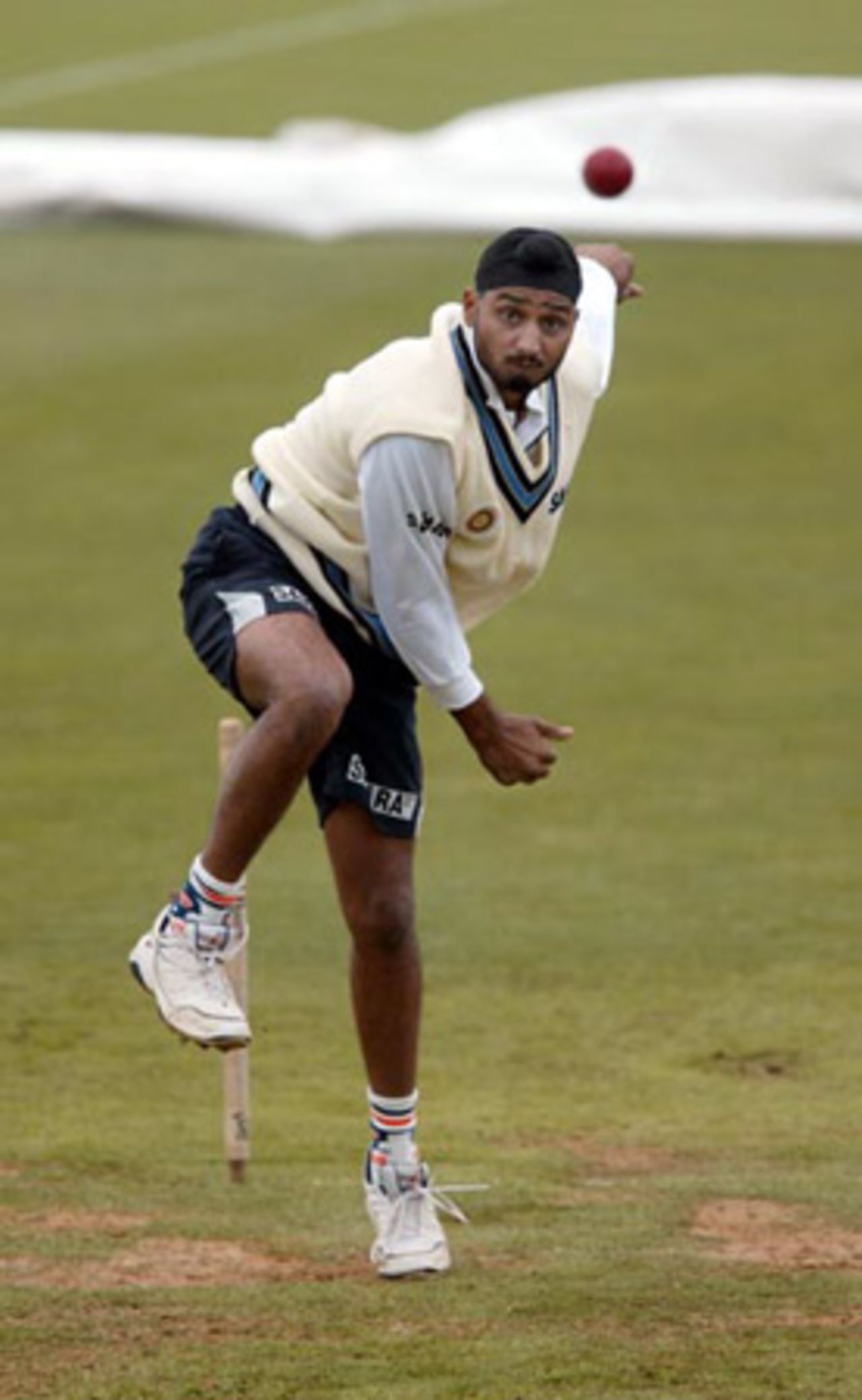 Indian bowler Harbhajan Singh delivers a ball during practice at the Basin Reserve, Wellington. 11 December 2002.