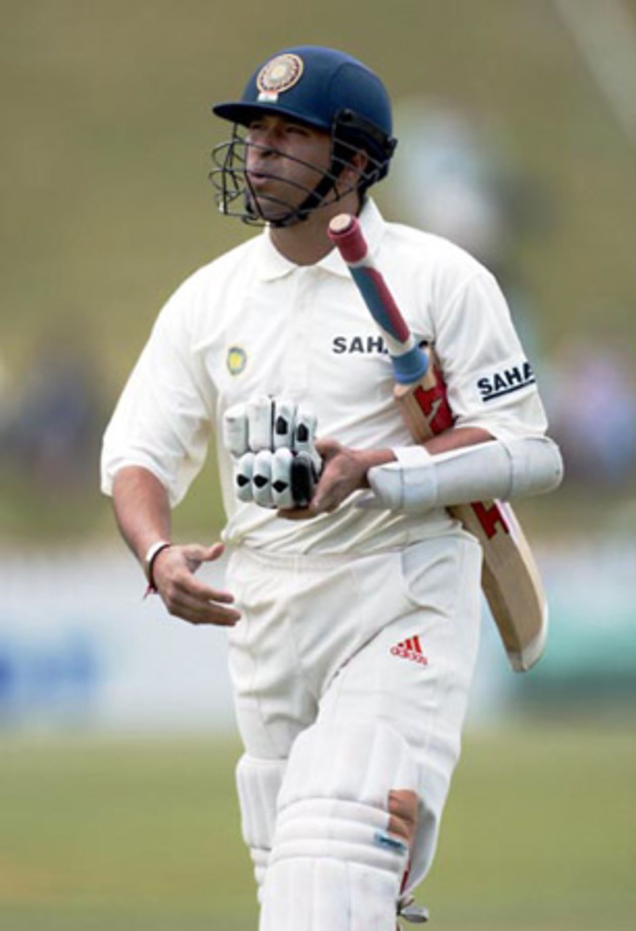Indian batsman Sachin Tendulkar leaves the field after being dismissed, lbw to New Zealand bowler Jacob Oram for eight. 1st Test: New Zealand v India at Basin Reserve, Wellington, 12-16 December 2002 (12 December 2002).