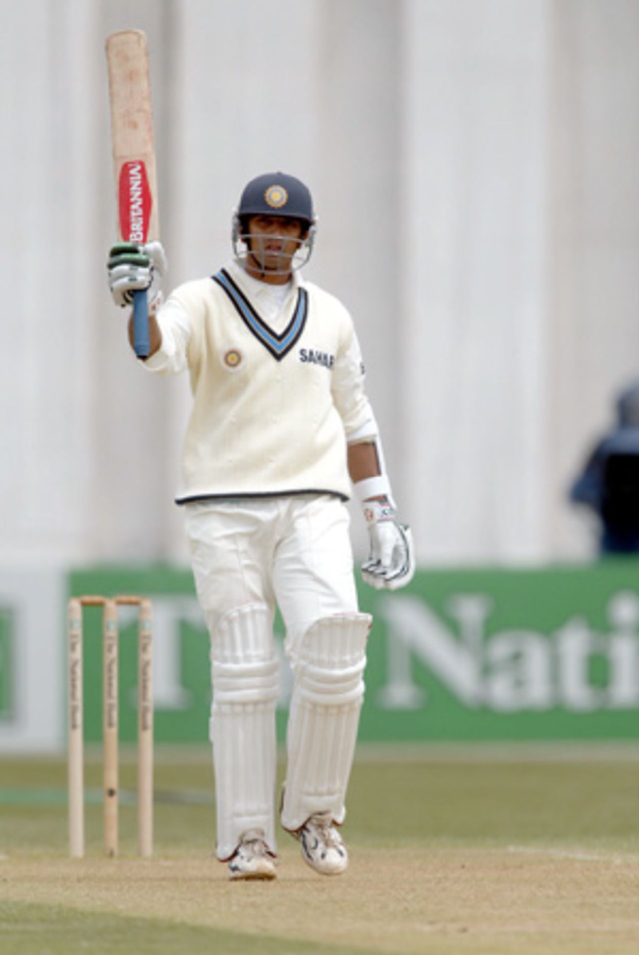 Indian batsman Rahul Dravid raises his bat to celebrate reaching his fifty in the first innings. 1st Test: New Zealand v India at Basin Reserve, Wellington, 12-16 December 2002 (12 December 2002).