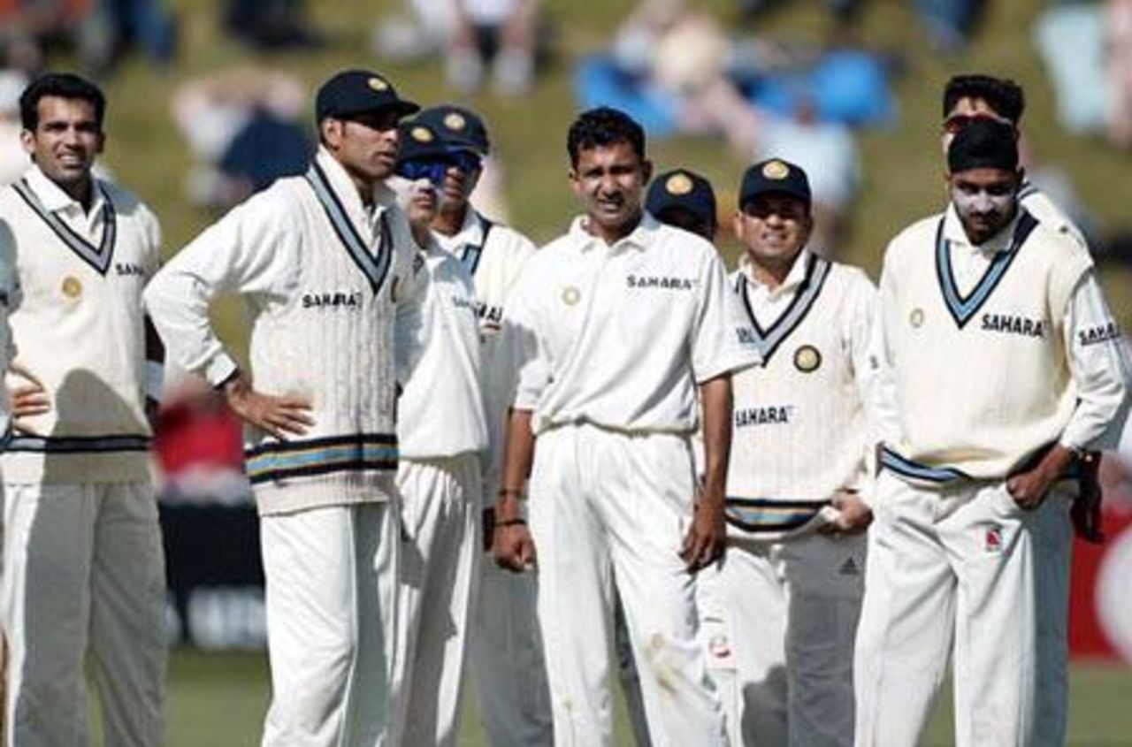 Members of the Indian team watch the replay of the dismissal of New Zealand batsman Craig McMillan, lbw to Sanjay Bangar for nine. From left: Zaheer Khan, VVS Laxman, Virender Sehwag, Rahul Dravid, Bangar, Parthiv Patel (obscured), Sachin Tendulkar, Ashish Nehra (obscured) and Harbhajan Singh. 1st Test: New Zealand v India at Basin Reserve, Wellington, 12-16 December 2002 (13 December 2002).
