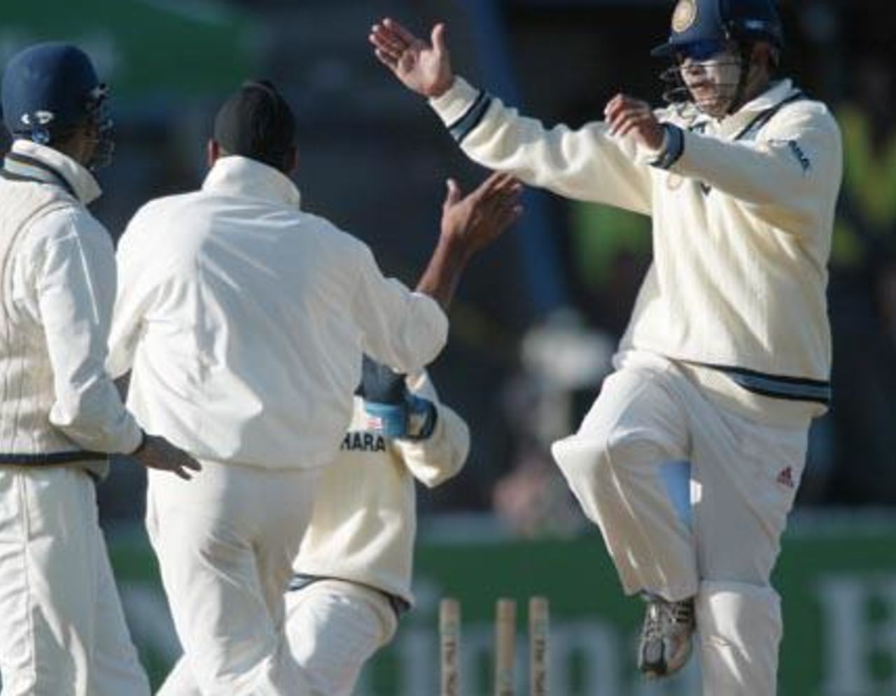Members of the Indian team celebrate the dismissal of New Zealand batsman Scott Styris, stumped by wicket-keeper Parthiv Patel off the bowling of Harbhajan Singh for 0. From left: VVS Laxman, Harbhajan, Patel (obscured) and Virender Sehwag. 1st Test: New Zealand v India at Basin Reserve, Wellington, 12-16 December 2002 (13 December 2002).