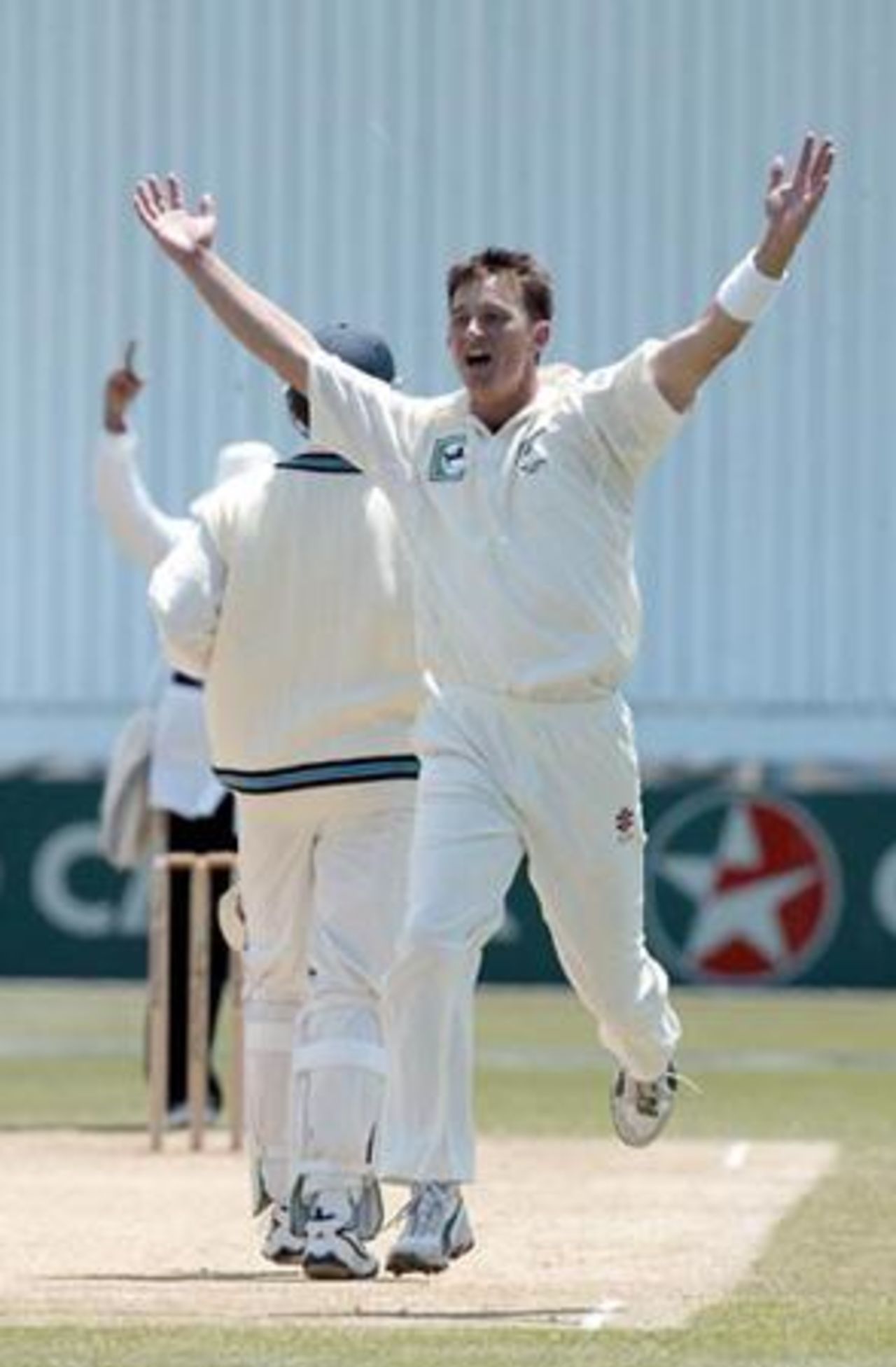 New Zealand bowler Shane Bond celebrates the dismissal of Indian batsman Sourav Ganguly, caught behind by wicket-keeper Robbie Hart for two in his second innings. 1st Test: New Zealand v India at Basin Reserve, Wellington, 12-16 December 2002 (14 December 2002).