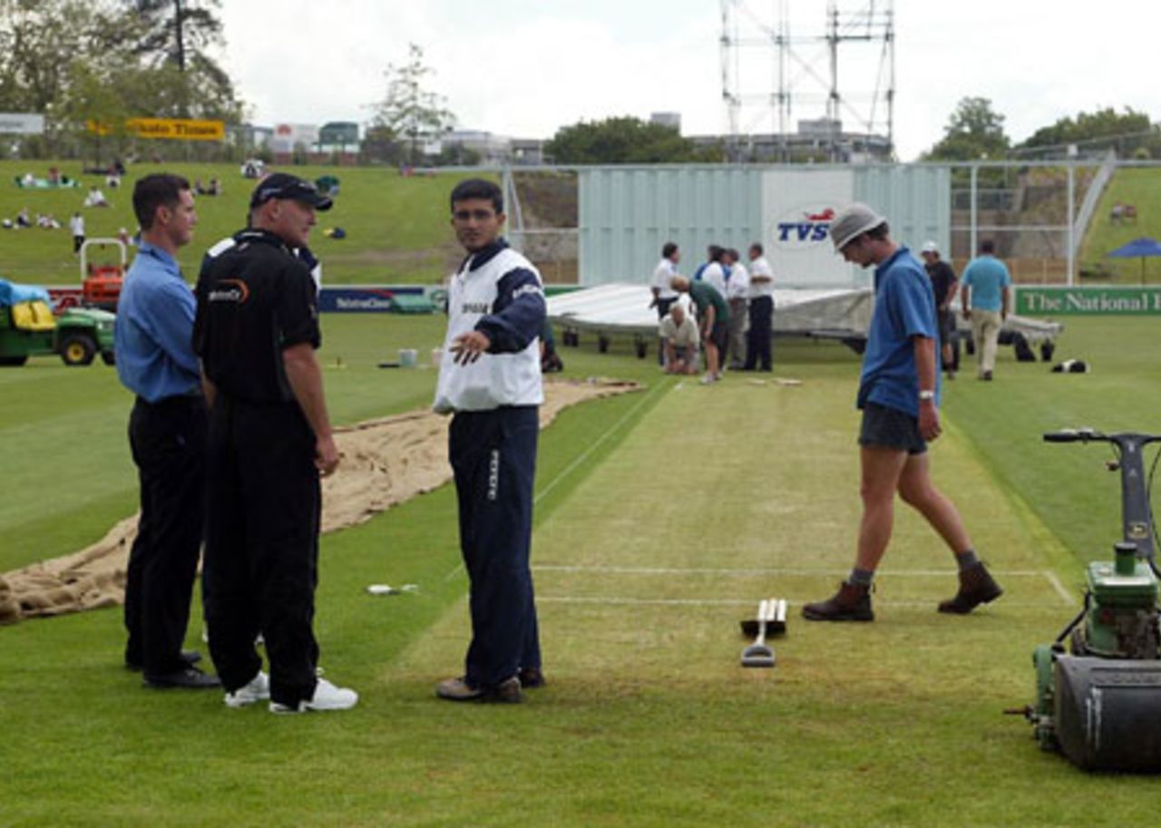 Indian captain Sourav Ganguly (third from left) talks to New Zealand manager Jeff Crowe (second from left) about the condition of the ground as the start of play is delayed. Play was eventually abandoned on day one. 2nd Test: New Zealand v India at Westpac Park, Hamilton, 19-23 December 2002 (19 December 2002).