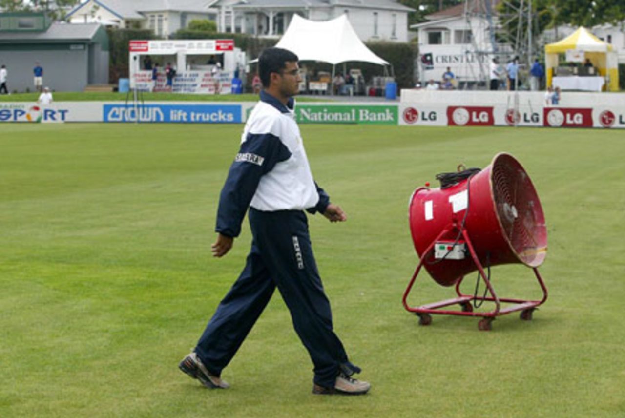 Indian captain Sourav Ganguly walks from the field after checking the condition of the ground as the start of play is delayed. Play was eventually abandoned on day one. 2nd Test: New Zealand v India at Westpac Park, Hamilton, 19-23 December 2002 (19 December 2002).