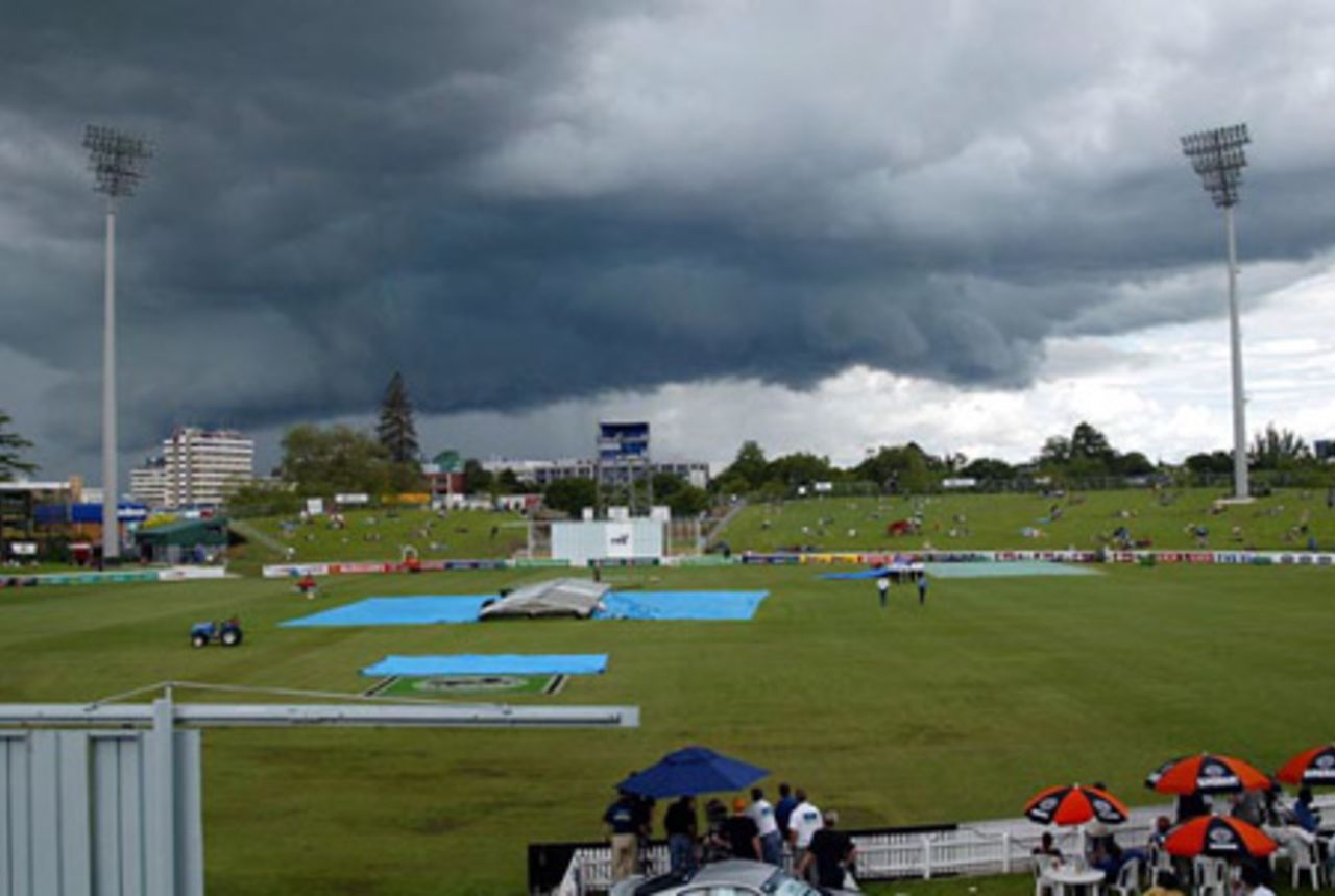 Dark cloud hovers over the ground as the covers are brought on. Play was eventually abandoned on day one at 2.45pm. 2nd Test: New Zealand v India at Westpac Park, Hamilton, 19-23 December 2002 (19 December 2002).