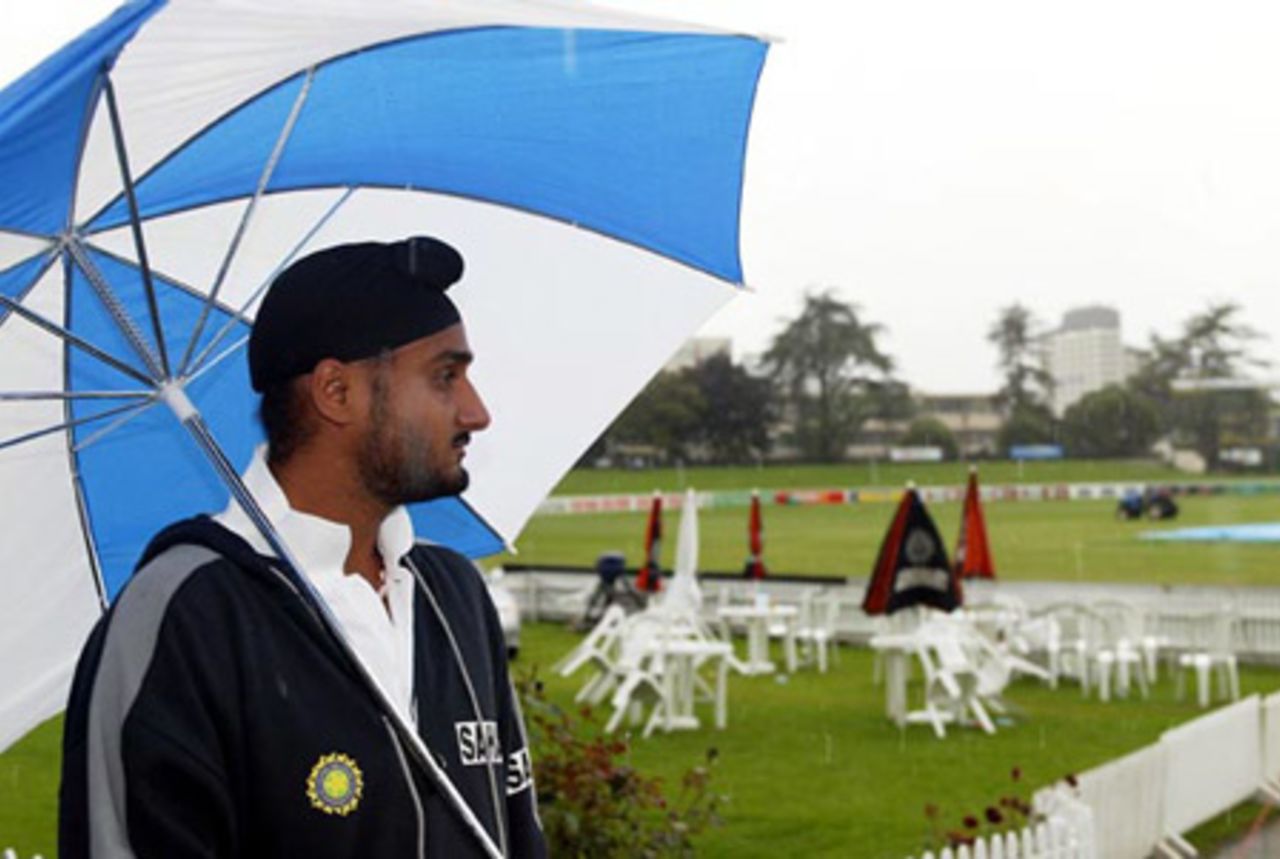 Indian player Harbhajan Singh looks on as it rains at the ground. Play was eventually abandoned on day one at 2.45pm. 2nd Test: New Zealand v India at Westpac Park, Hamilton, 19-23 December 2002 (19 December 2002).