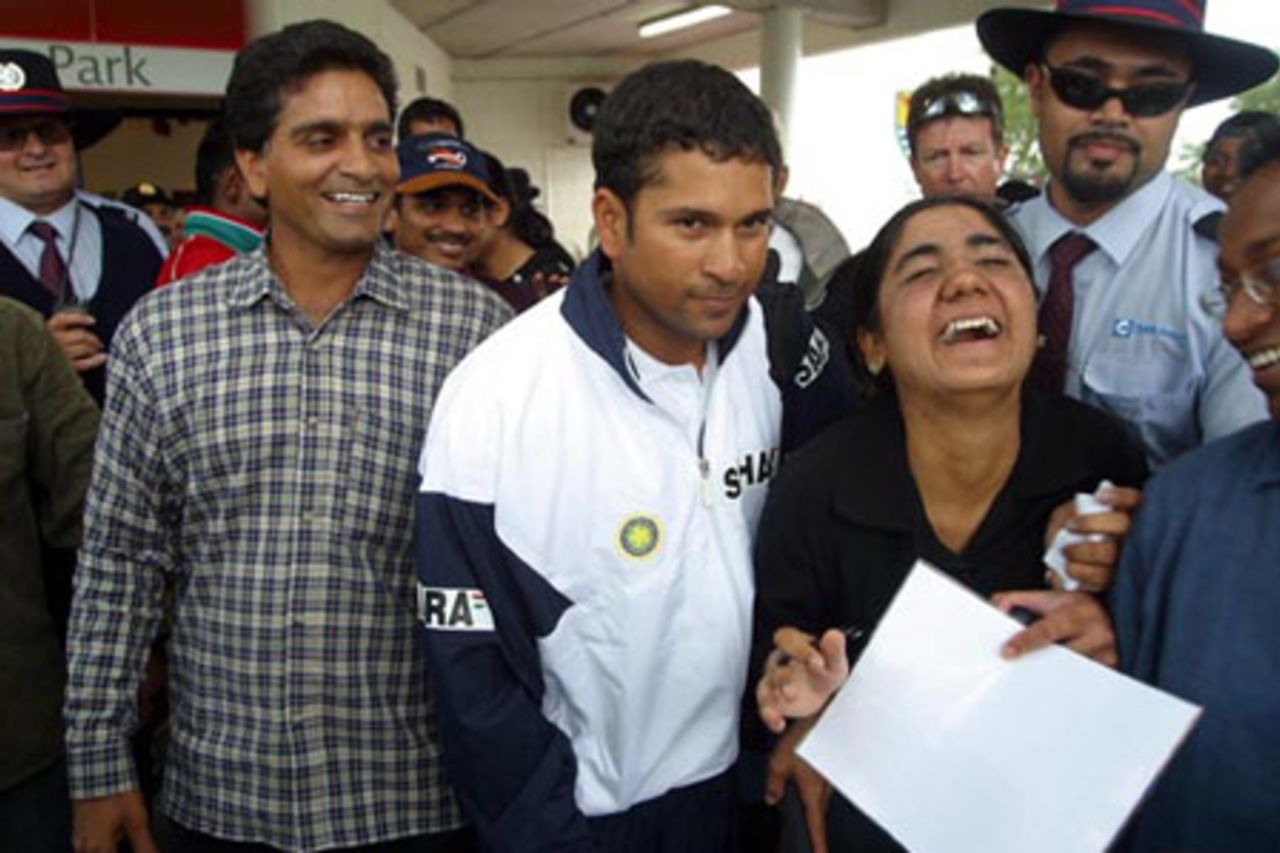 Indian player Sachin Tendulkar (centre) signs autographs for fans as he leaves the ground. 2nd Test: New Zealand v India at Westpac Park, Hamilton, 19-23 December 2002 (19 December 2002).