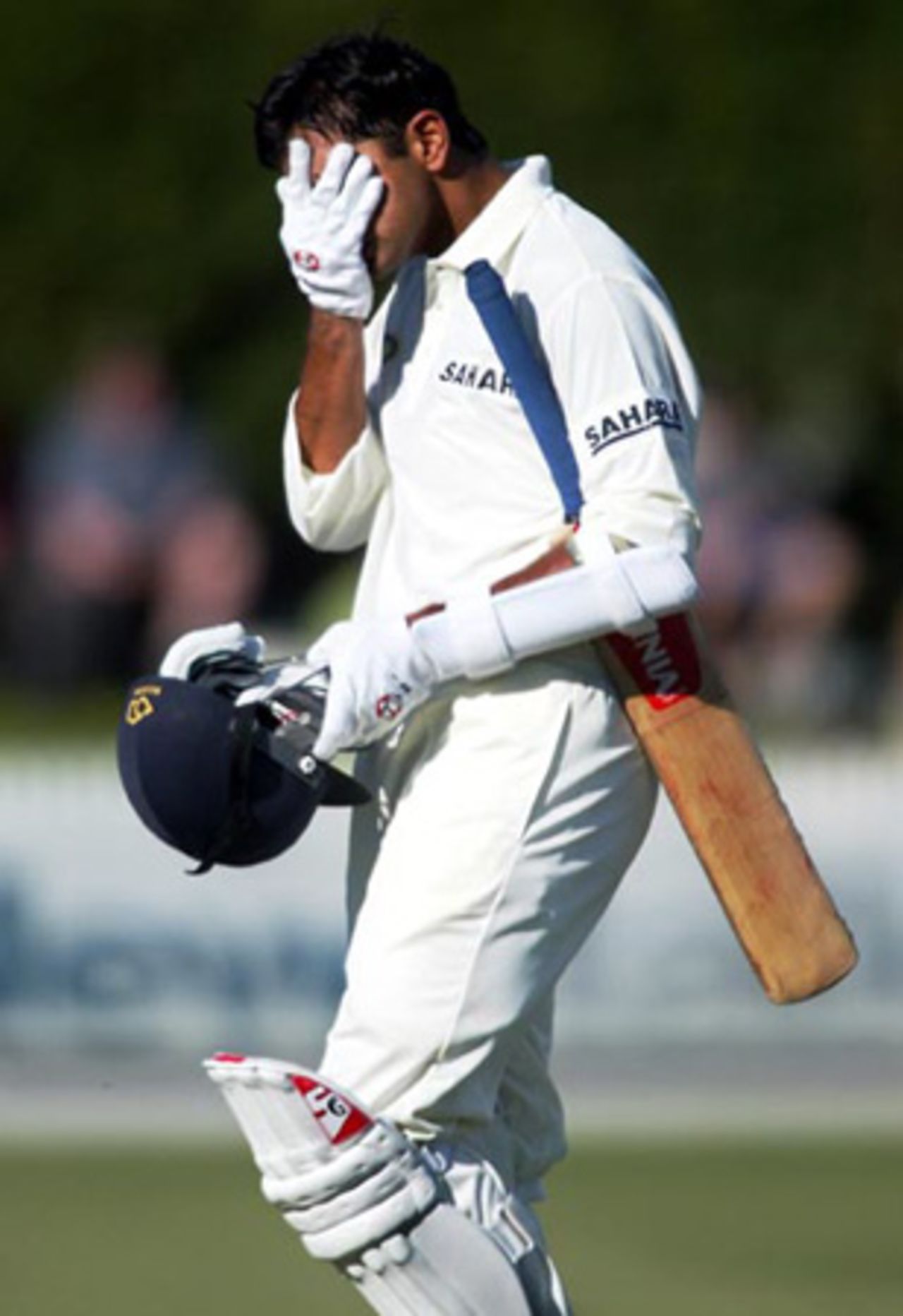 Indian batsman Rahul Dravid leaves the field after being dismissed, caught by wicket-keeper Robbie Hart off the bowling of Daryl Tuffey for nine. 2nd Test: New Zealand v India at Westpac Park, Hamilton, 19-23 December 2002 (20 December 2002).