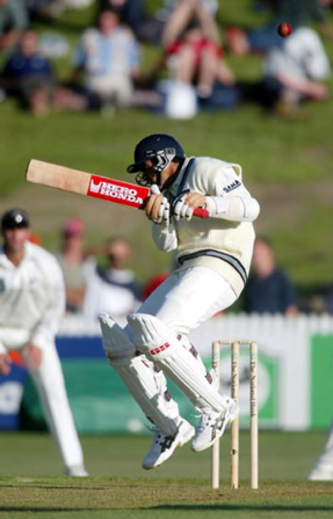 Indian batsman Zaheer Khan ducks underneath a bouncer from New Zealand bowler Shane Bond during his first innings of 0. 2nd Test: New Zealand v India at Westpac Park, Hamilton, 19-23 December 2002 (20 December 2002).