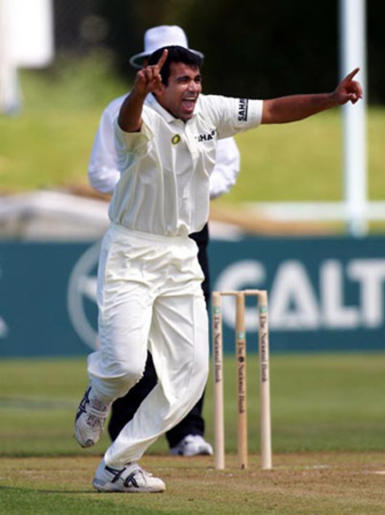 Indian bowler Zaheer Khan celebrates the dismissal of New Zealand batsman Lou Vincent, caught by Rahul Dravid at first slip off the bowling of Khan for three. 2nd Test: New Zealand v India at Westpac Park, Hamilton, 19-23 December 2002 (21 December 2002).