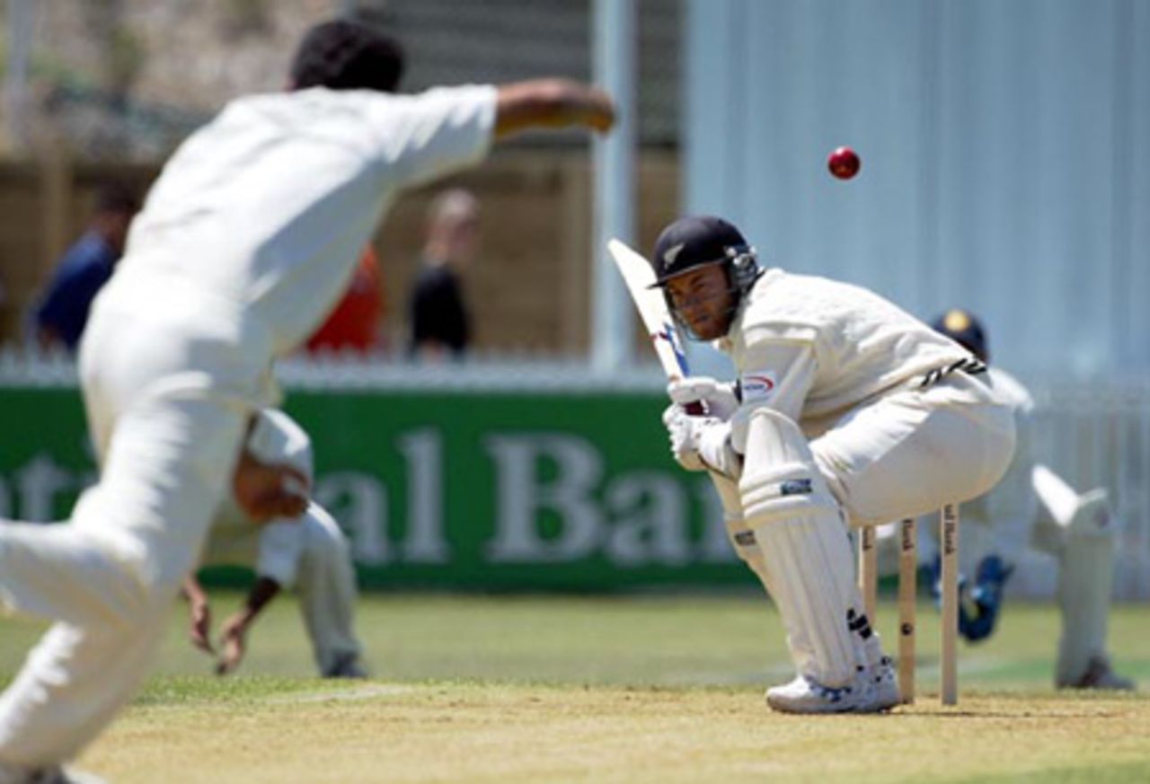 New Zealand batsman Craig McMillan ducks underneath a bouncer from Indian bowler Ashish Nehra during his first innings of four. 2nd Test: New Zealand v India at Westpac Park, Hamilton, 19-23 December 2002 (21 December 2002).