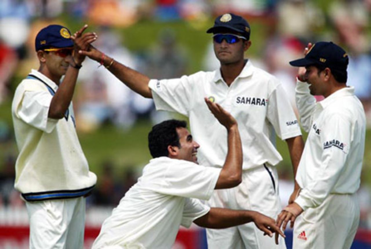 Members of the Indian team celebrate the dismissal of New Zealand batsman Daryl Tuffey, run out for 13. From left: substitute fielder Shiv Sunder Das, Zaheer Khan, Sourav Ganguly and Sachin Tendulkar. 2nd Test: New Zealand v India at Westpac Park, Hamilton, 19-23 December 2002 (21 December 2002).
