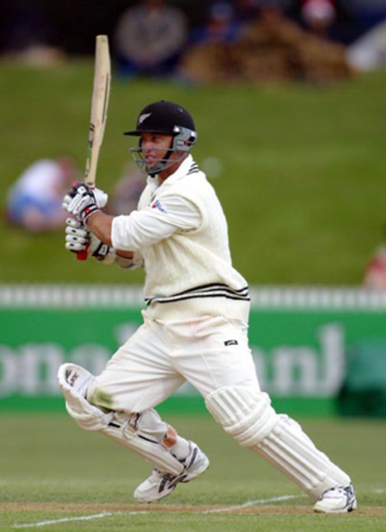 New Zealand batsman Mark Richardson drives a delivery down the ground on the off side during his second innings. Richardson ended the third day on 18 not out. 2nd Test: New Zealand v India at Westpac Park, Hamilton, 19-23 December 2002 (21 December 2002).