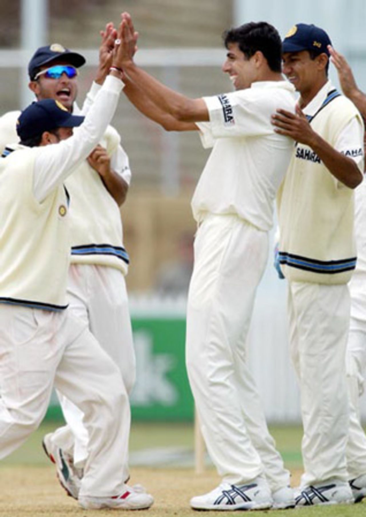 Members of the Indian team celebrate the dismissal of New Zealand batsman Craig McMillan, lbw to Ashish Nehra for 18 in his second innings. From left: Sachin Tendulkar, Sourav Ganguly, Nehra and Tinu Yohannan. 2nd Test: New Zealand v India at Westpac Park, Hamilton, 19-23 December 2002 (22 December 2002).