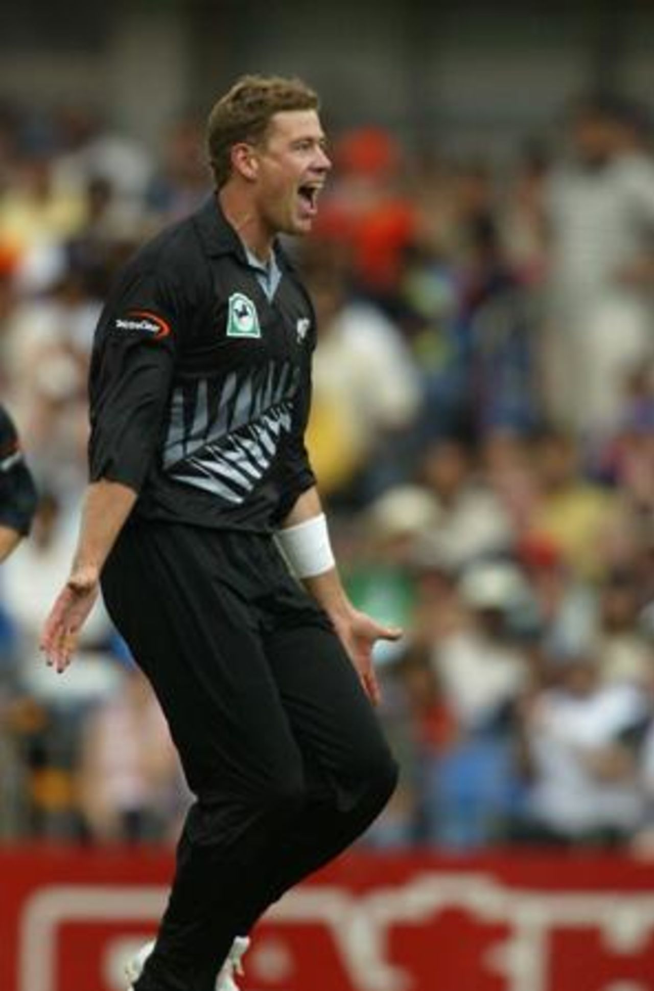 New Zealand bowler Jacob Oram celebrates the dismissal of Indian batsman Yuvraj Singh, caught by Nathan Astle at second slip for two. 1st ODI: New Zealand v India at Eden Park, Auckland, 26 December 2002.
