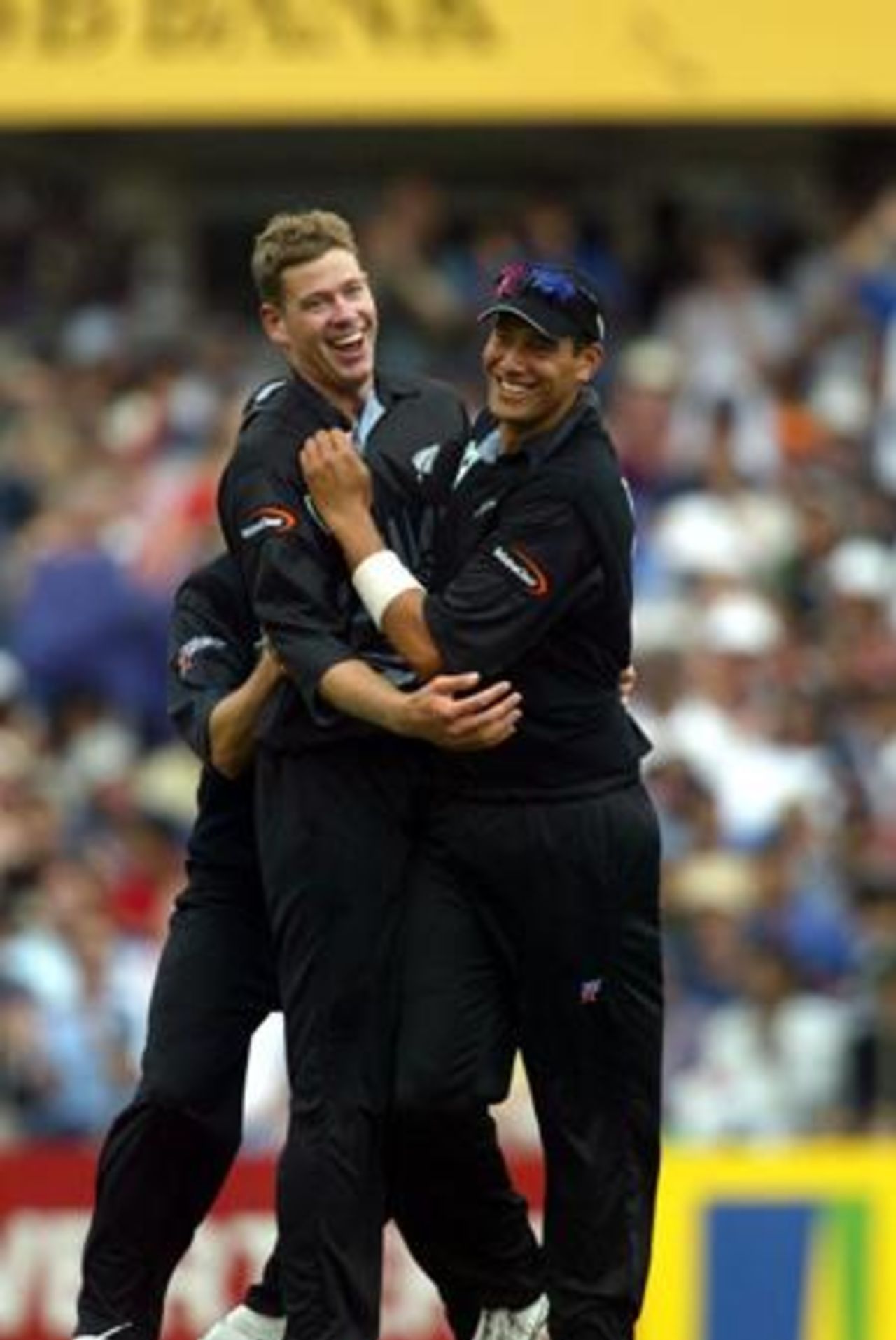 New Zealand bowler Jacob Oram (left) is congratulated by team-mate Daryl Tuffey after dismissing Indian batsman Yuvraj Singh, caught by Nathan Astle at second slip for two. 1st ODI: New Zealand v India at Eden Park, Auckland, 26 December 2002.