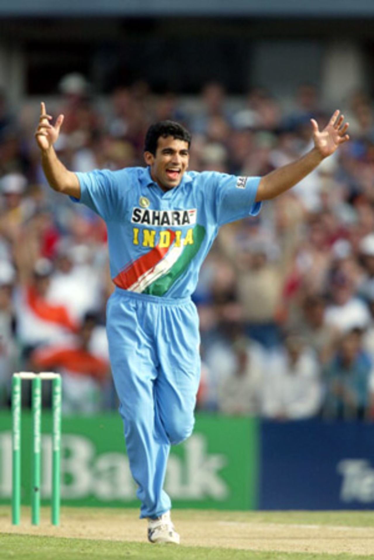 Indian bowler Zaheer Khan celebrates the dismissal of New Zealand batsman Mathew Sinclair, caught by Sourav Ganguly at point for 15. 1st ODI: New Zealand v India at Eden Park, Auckland, 26 December 2002.