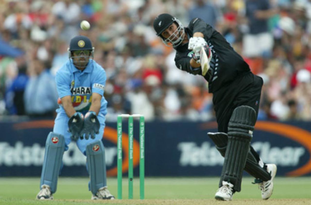 New Zealand batsman Mathew Sinclair lofts a delivery from Indian bowler Harbhajan Singh over extra cover for six during his innings of 78 as wicket-keeper Rahul Dravid looks on. 2nd ODI: New Zealand v India at McLean Park, Napier, 29 December 2002.