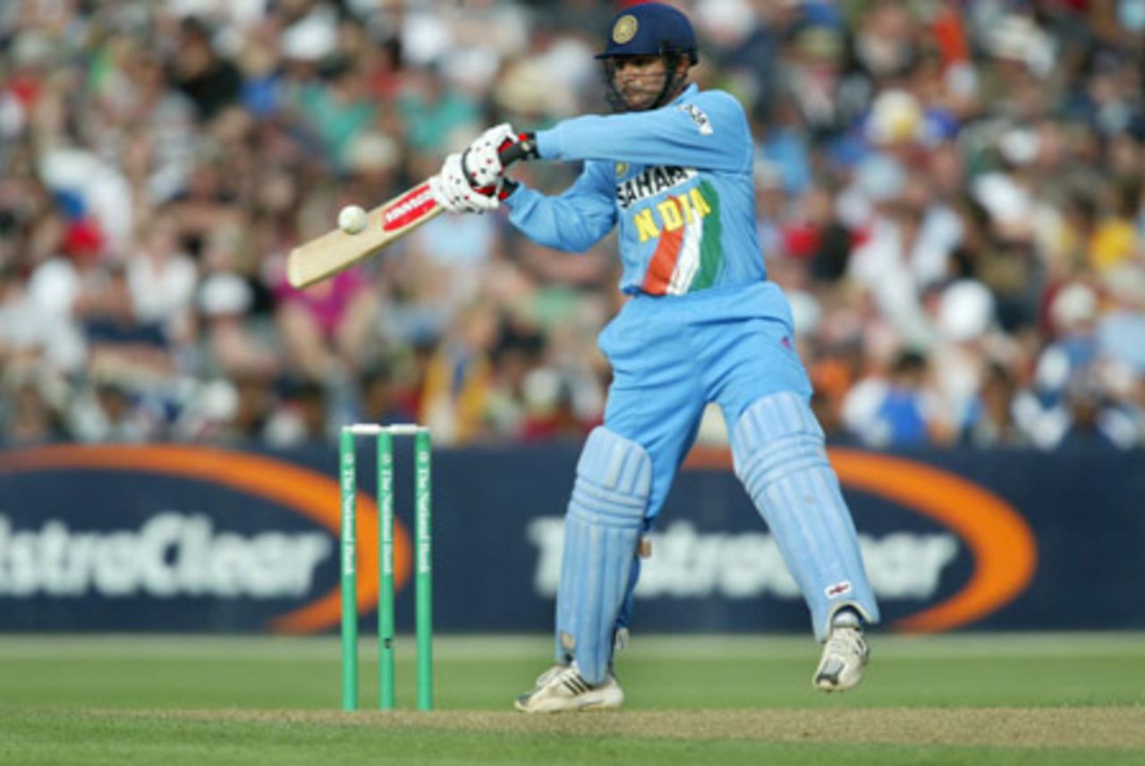 Indian batsman Virender Sehwag cuts a delivery from New Zealand bowler Jacob Oram for six over point during his innings of 108. 2nd ODI: New Zealand v India at McLean Park, Napier, 29 December 2002.