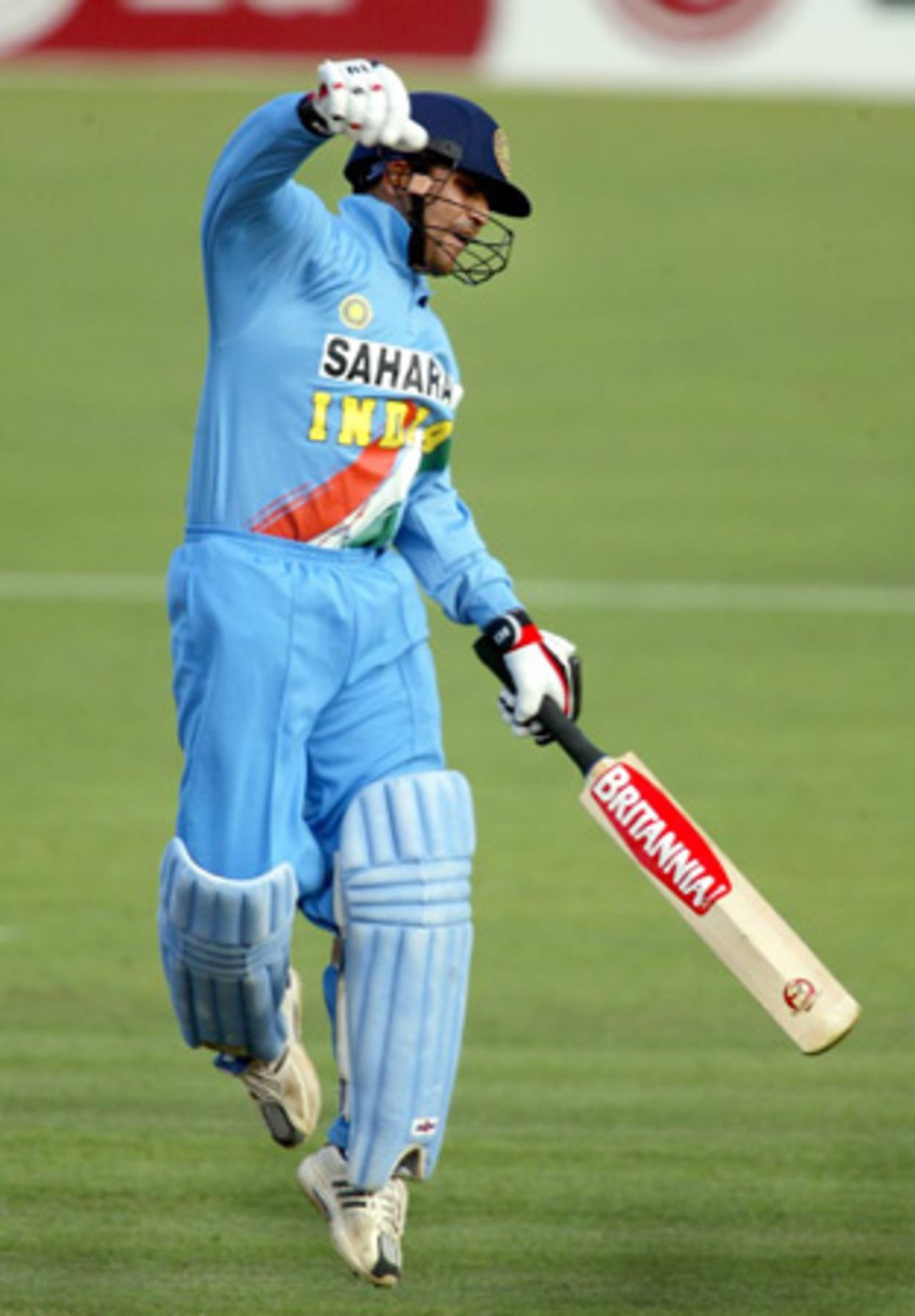 Indian batsman Virender Sehwag celebrates reaching his century. Sehwag went on to score 108. 2nd ODI: New Zealand v India at McLean Park, Napier, 29 December 2002.