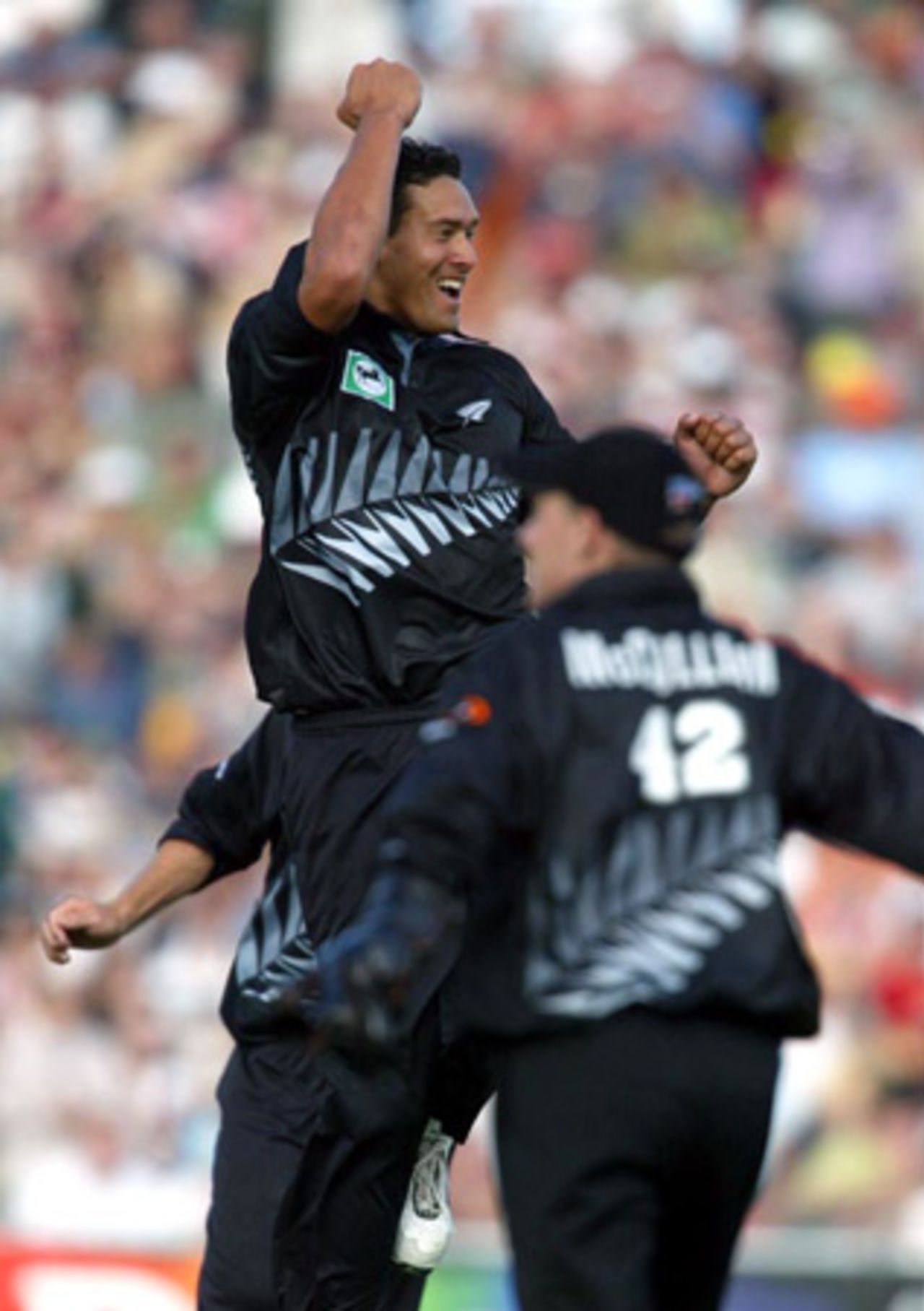 New Zealand bowler Daryl Tuffey leaps to celebrate the dismissal of Indian batsman Mohammad Kaif, caught by wicket-keeper Brendon McCullum (right) for 24. 2nd ODI: New Zealand v India at McLean Park, Napier, 29 December 2002.