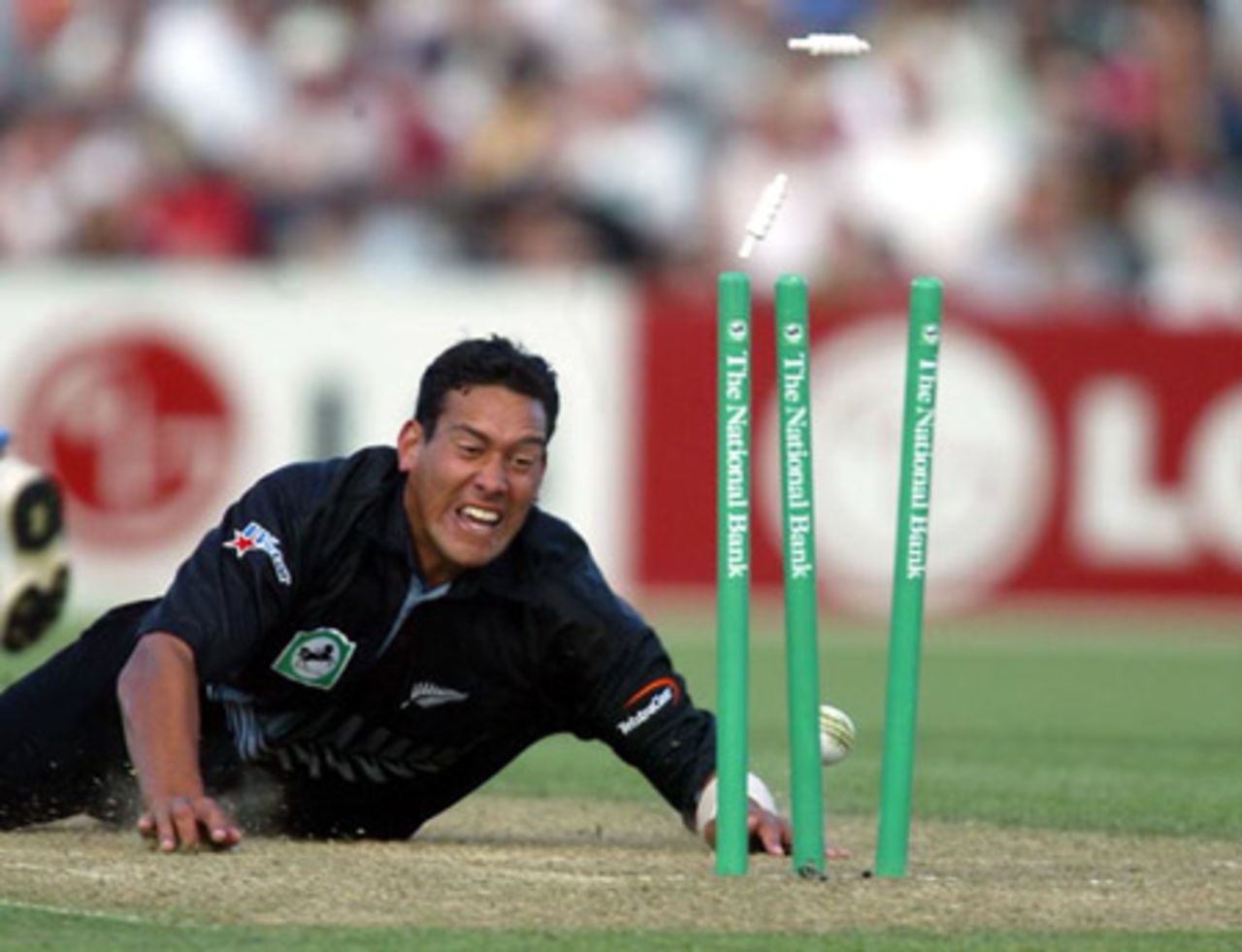 New Zealand fielder Daryl Tuffey dives to run out Indian batsman Virender Sehwag for 108. 2nd ODI: New Zealand v India at McLean Park, Napier, 29 December 2002.
