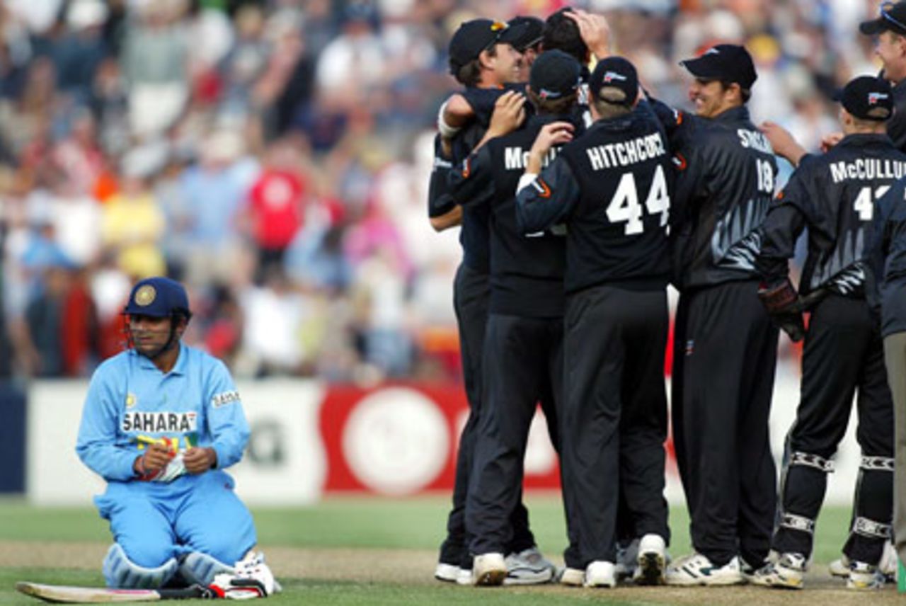 Indian batsman Virender Sehwag awaits his fate from the third umpire as members of the New Zealand team celebrate his run out for 108. From left: Sehwag, Stephen Fleming, Craig McMillan, Daryl Tuffey (obscured), Paul Hitchcock, Mathew Sinclair, Brendon McCullum and Jacob Oram. 2nd ODI: New Zealand v India at McLean Park, Napier, 29 December 2002.
