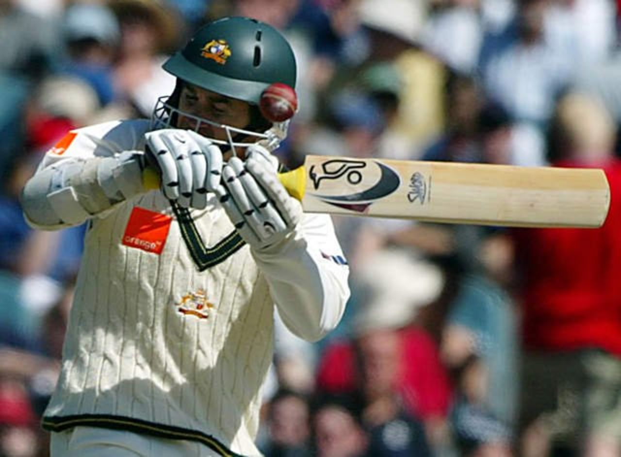 Australia's Justin Langer is hit by a bouncer during his innings of 250 in Melbourne, Thu 26 Dec 2002