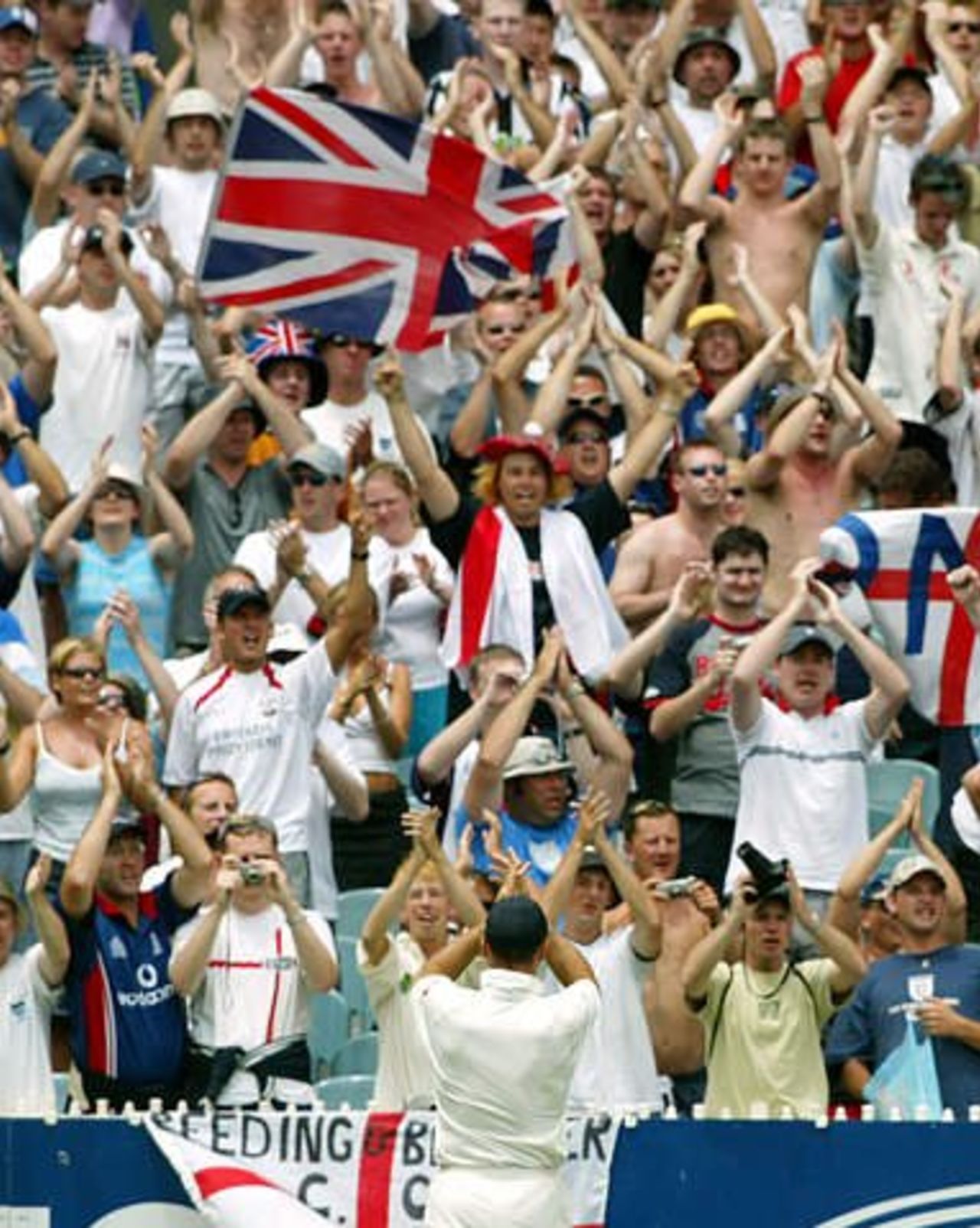 Nasser Hussain applauds England's travelling Barmy Army fans following the conclusion of the Melbourne Test, Mon 30 Dec 2002