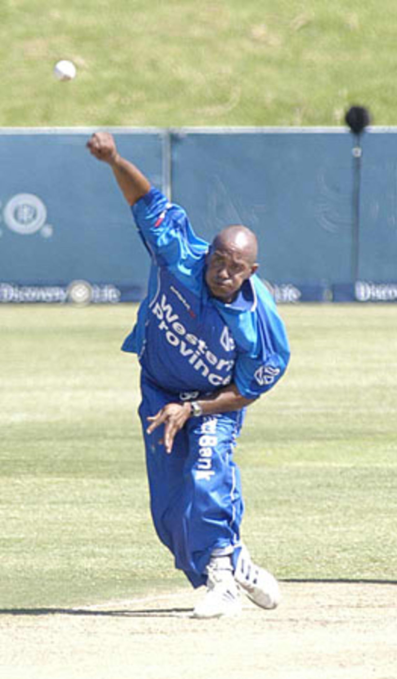 Roger Telemachus in his delivery stride against Boland
