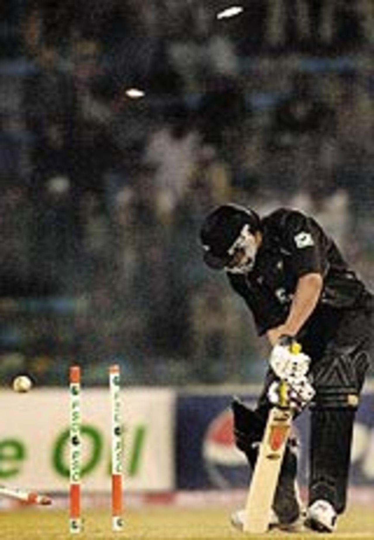New Zealand batsman Tama Canning is clean bowled off Pakistani pace bowler Mohammad Sami (not in the picture) during the second One Day International (ODI) match between Pakistan and New Zealand at the Gaddafi stadium in Lahore, 01 December 2003