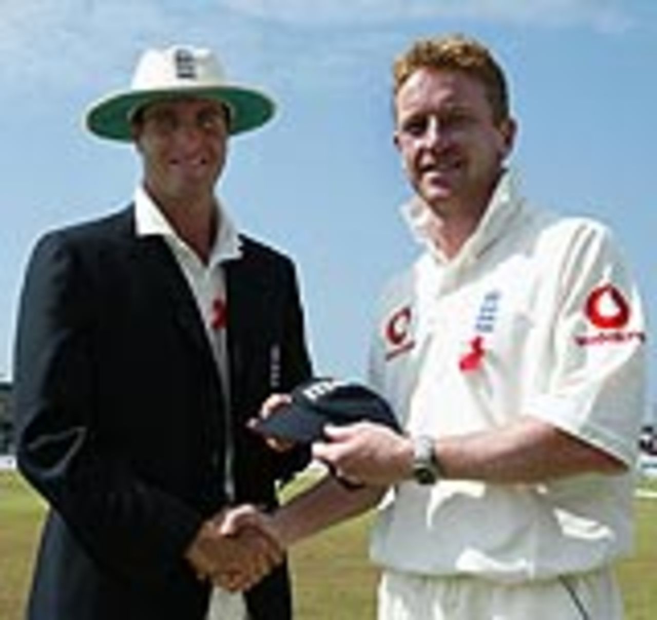 Paul Collingwood receives his England cap from Michael Vaughan