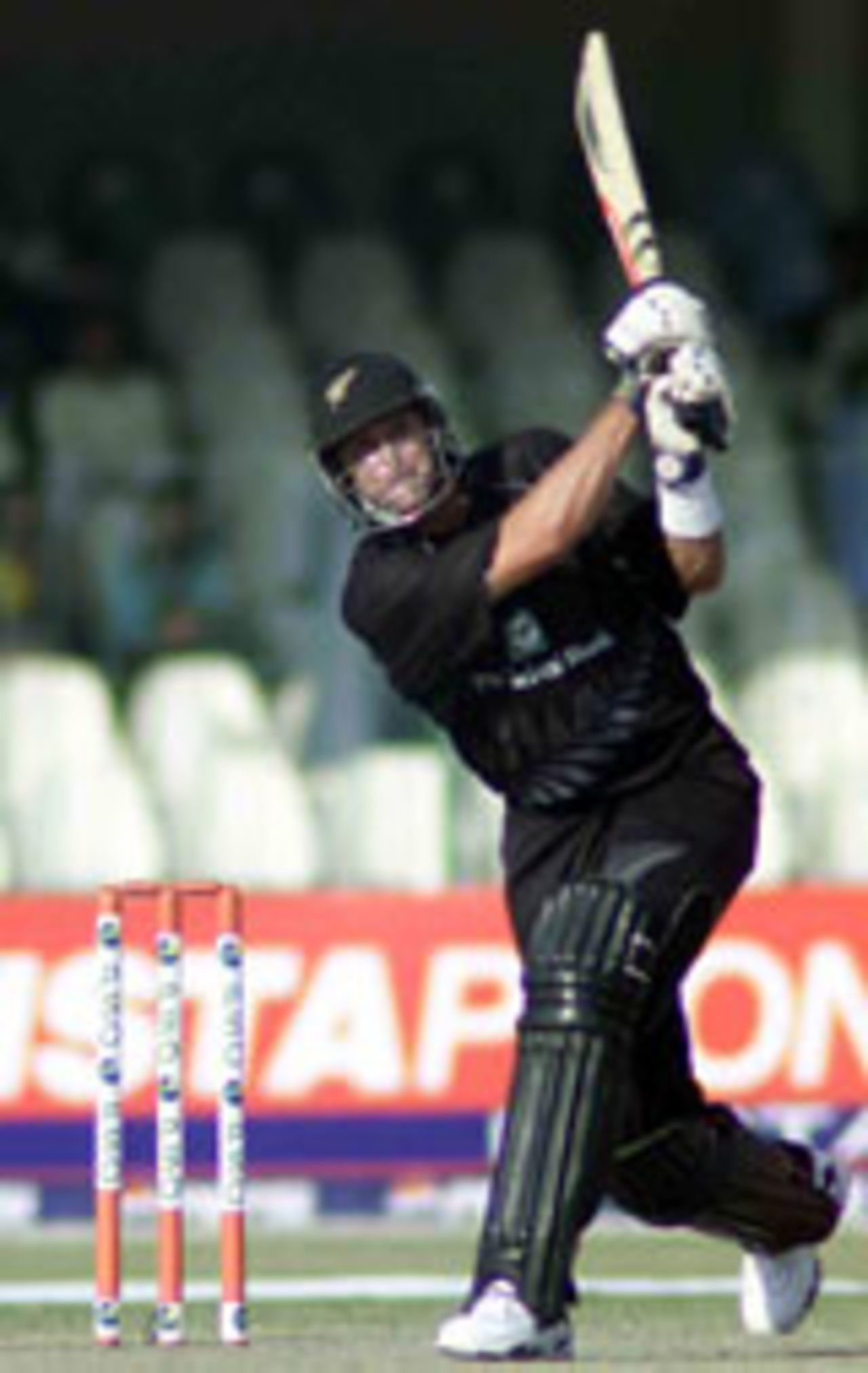 Chris Cairns blasts a six during his blazzing 84, Pakistan v New Zealand, 1st ODI, Lahore, November 29, 2003.