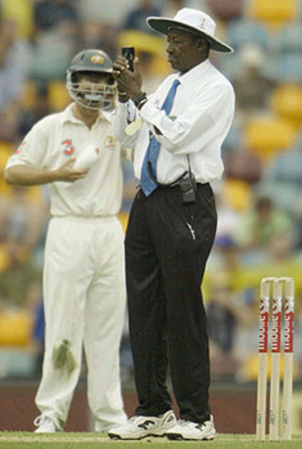 Steve Bucknor consults the light meter, Australia v India, 1st Test, Brisbane, 3rd day, December 6, 2003