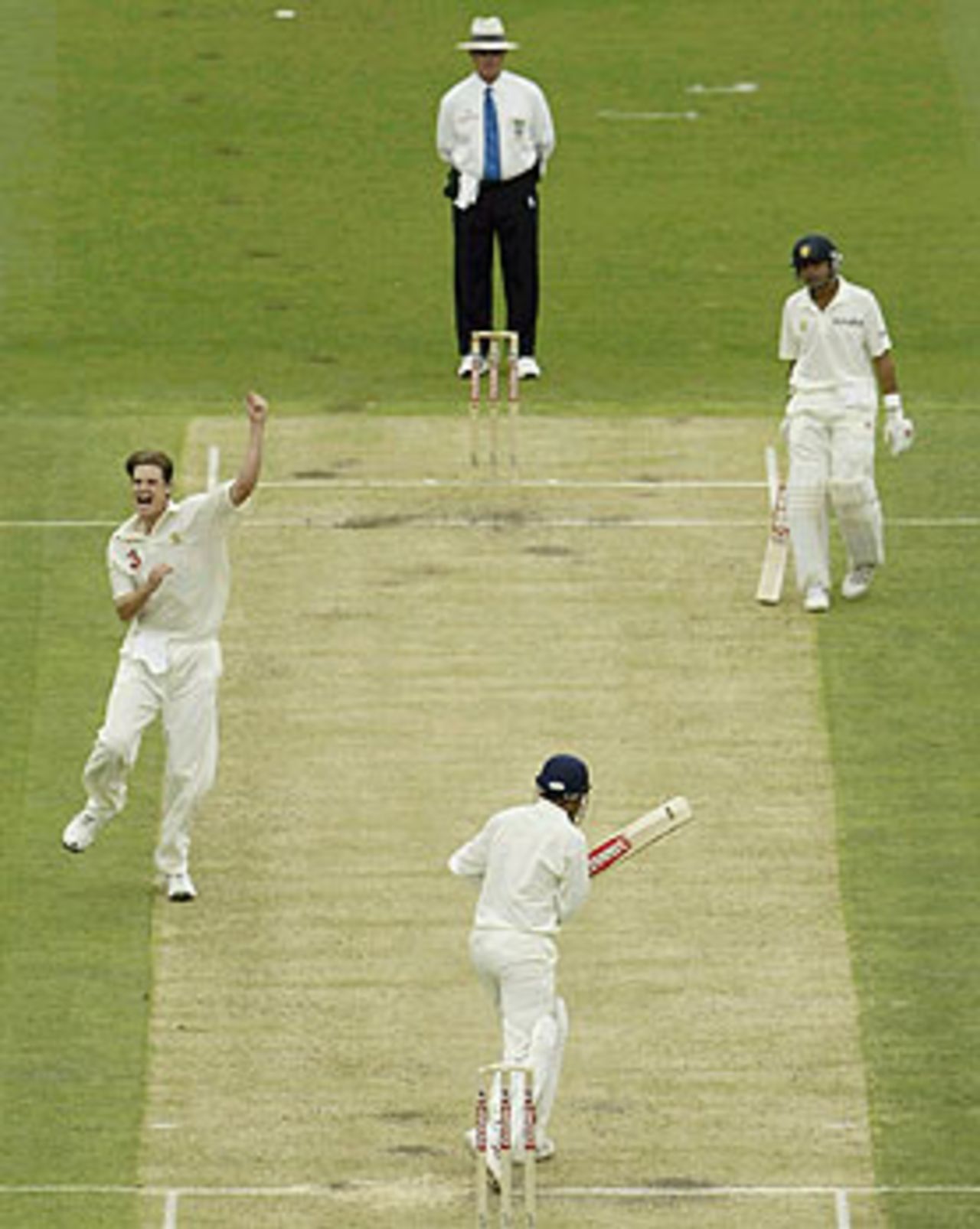 Nathan Bracken celebrates his first Test wicket, that of Virender Sehwag, Australia v India, 1st Test, Brisbane, 4th day, December 7, 2003