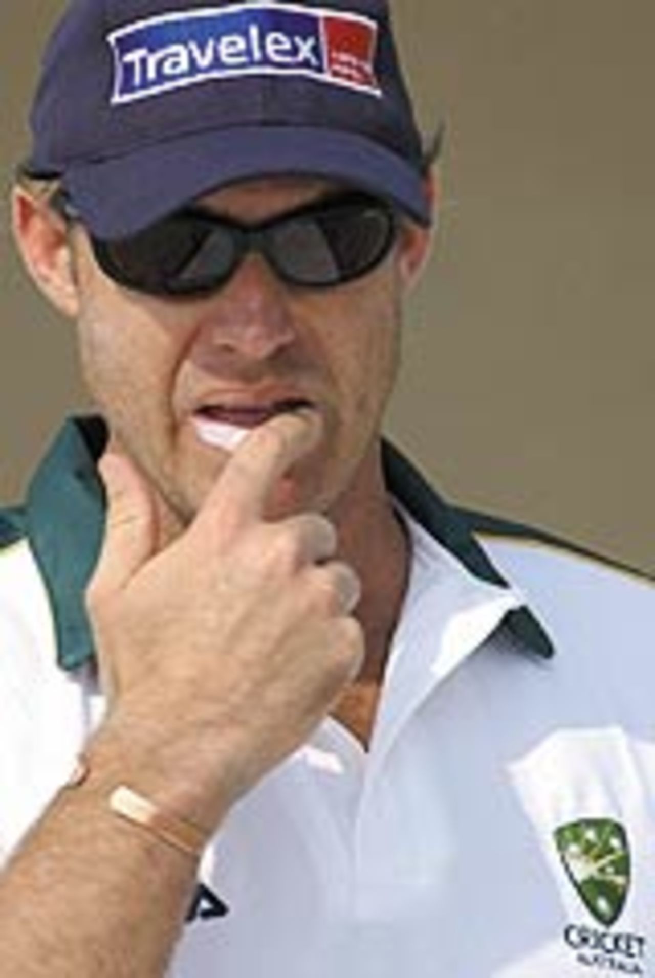 Australian national cricket team player Matthew Hayden applies lip balm to his lips during a practice session in New Delhi, 24 October 2003