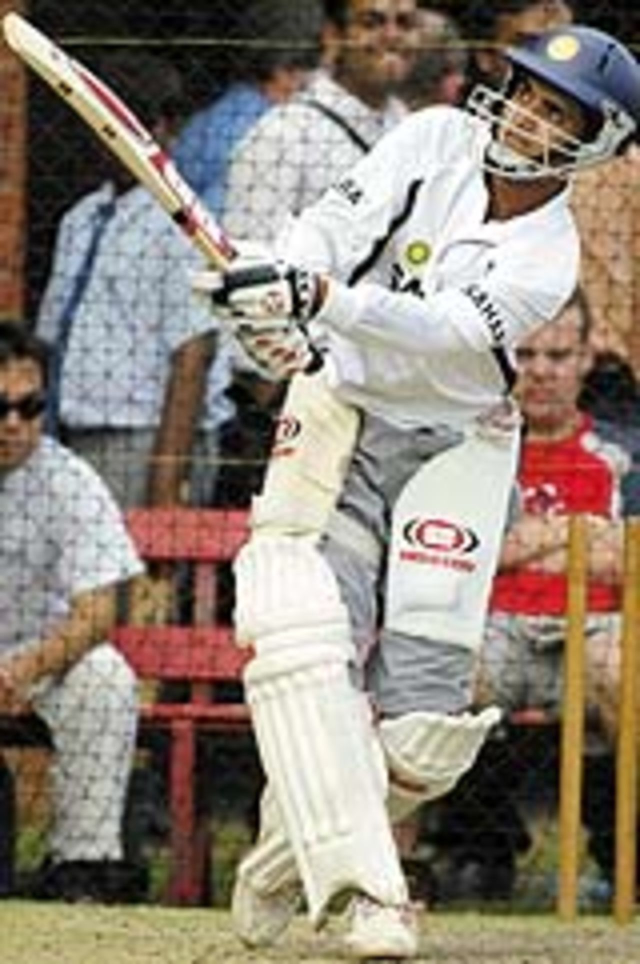 Indian captain Sourav Ganguly hits out against the bowling during a net session as India prepares for the second cricket Test against Australia, in Adelaide 11 December 2003.